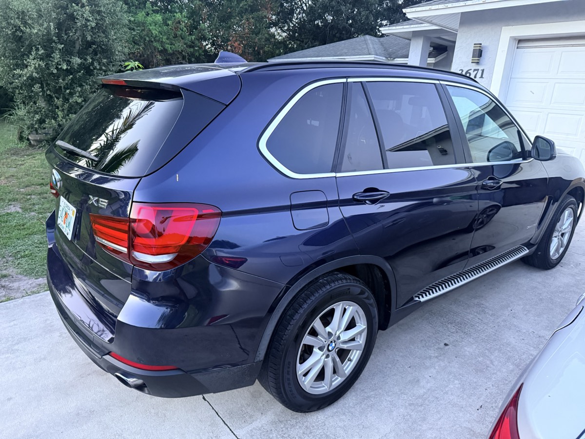 Black BMW SUV gleaming after a complete exterior detail